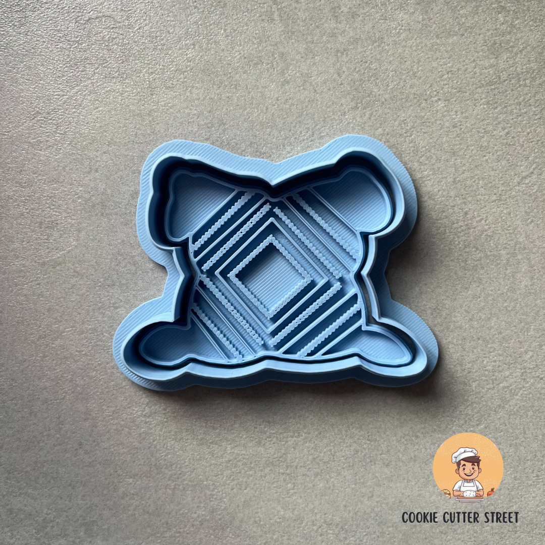 Blue Boho Cushion cookie cutter with geometric design on a grey background