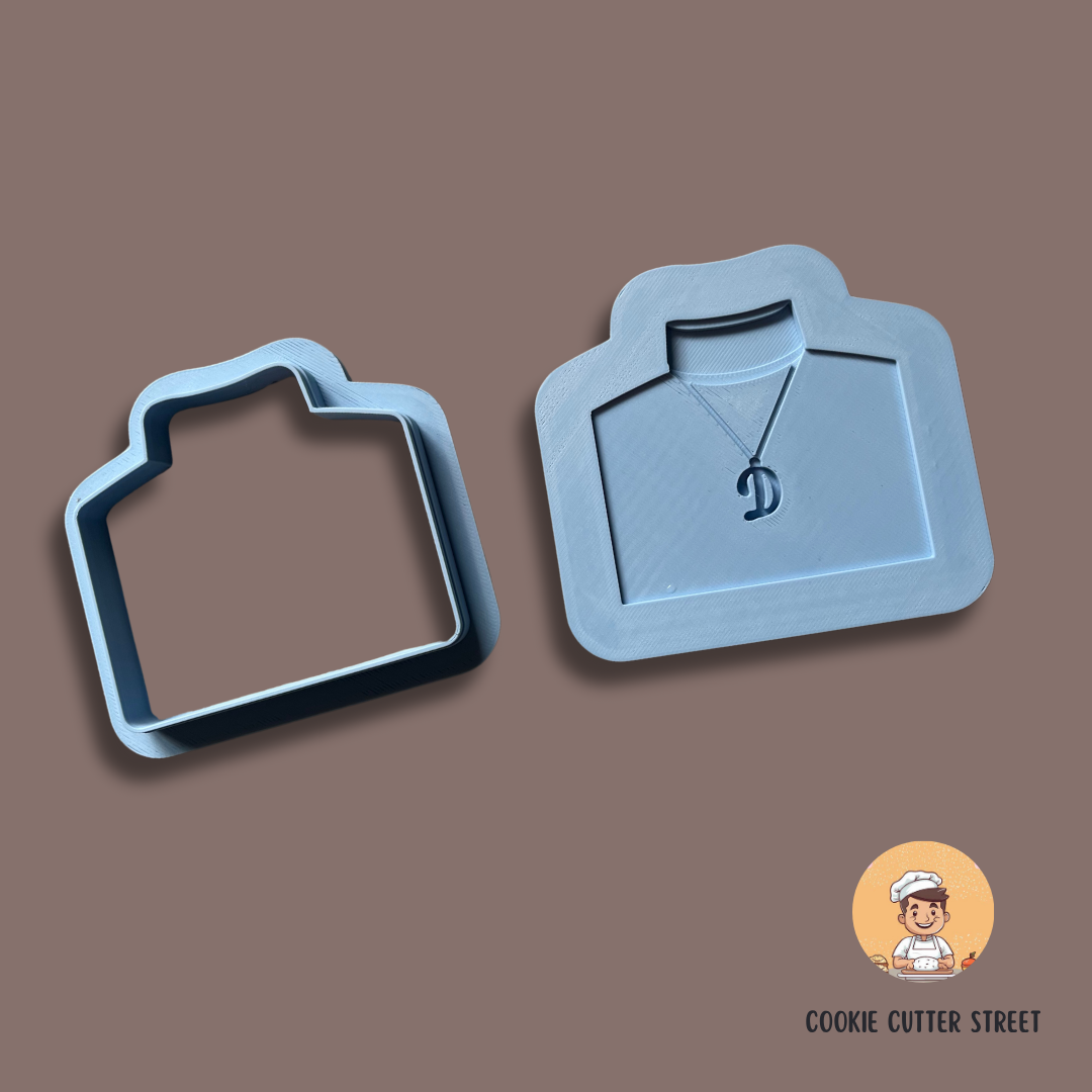 An Only Fools and Horses-themed cookie cutters and icing embossers, featuring Del Boy’s neckchain & jumper
