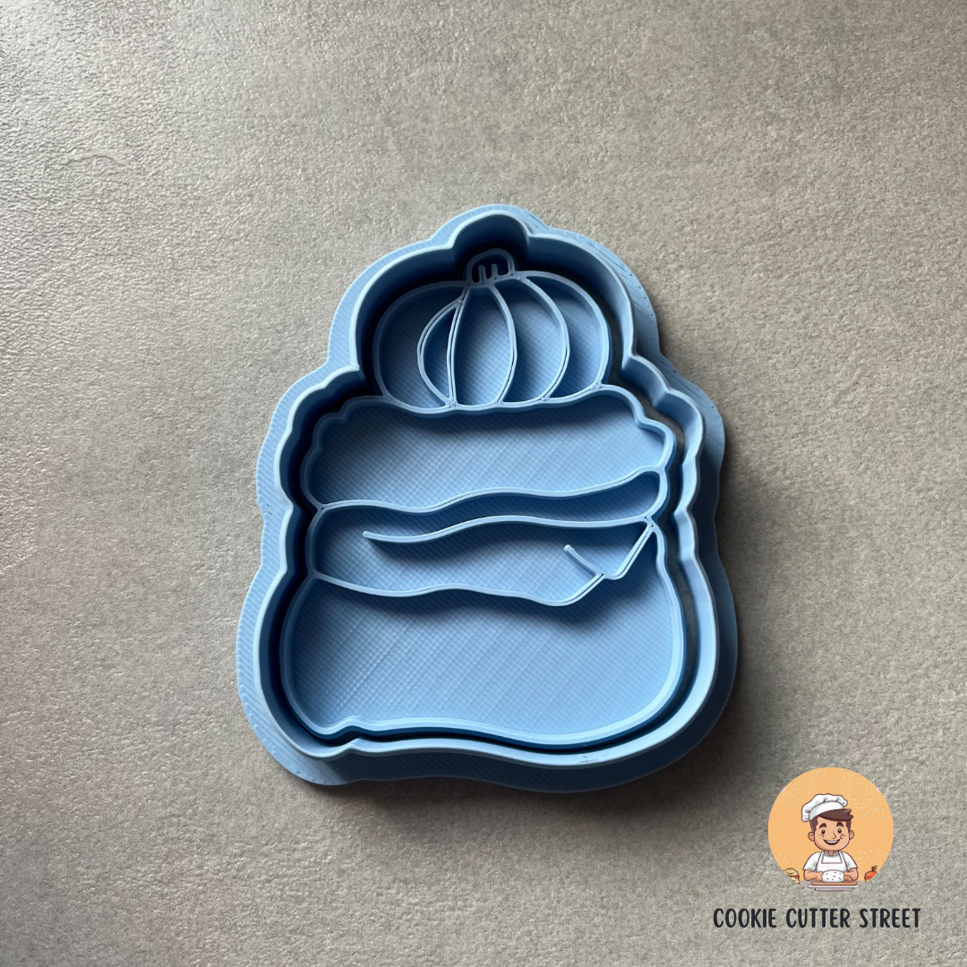 Blue pumpkin-shaped cookie cutter on a gray background