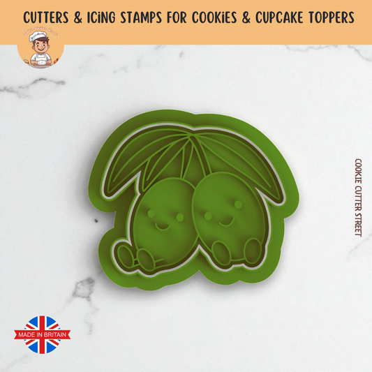 Green Pair of Olives cookie cutter with two olives on a white background, branded 'Cookie Cutter Street'.