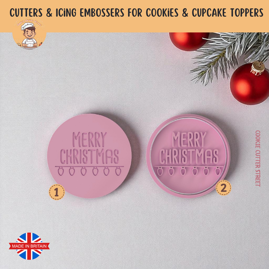 Pink 'Merry Christmas' cookie cutters on a light gray background with Christmas decorations.