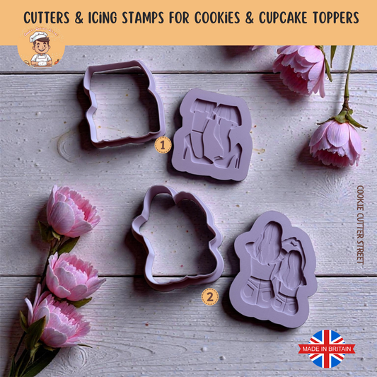 Two mummy and child raised cookie stamps with matching cutters, styled with pink flowers on a wooden background.
